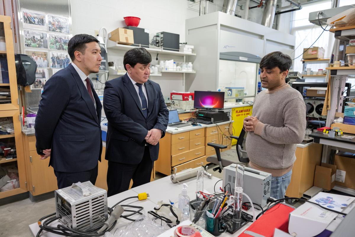 Officials from the Civil Aviation Academy in Almaty, Kazakhstan tour the College of Aeronautics and Engineering.