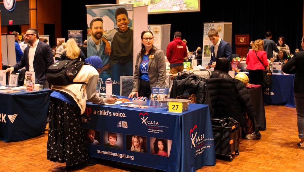 Student visits an employer table at the 2026 Career Fair