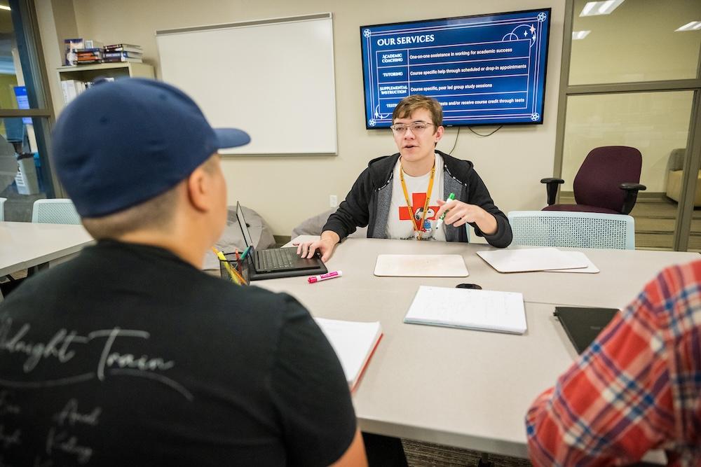 Students at the Academic Success Center work with tutors