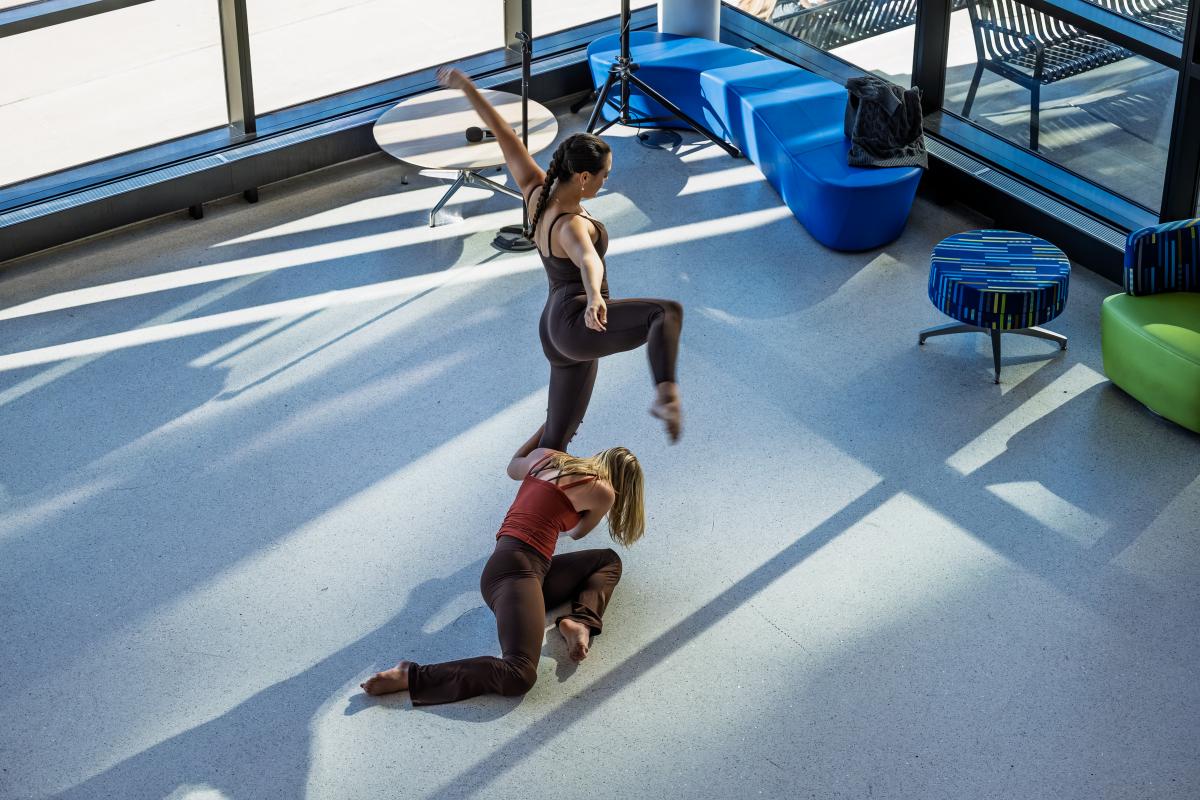 Dance majors Cassidy Cipollo of Lakewood, Ohio, and Macey Przybylski of Toledo, Ohio, perform in the lobby of the Integrated Sciences Building.