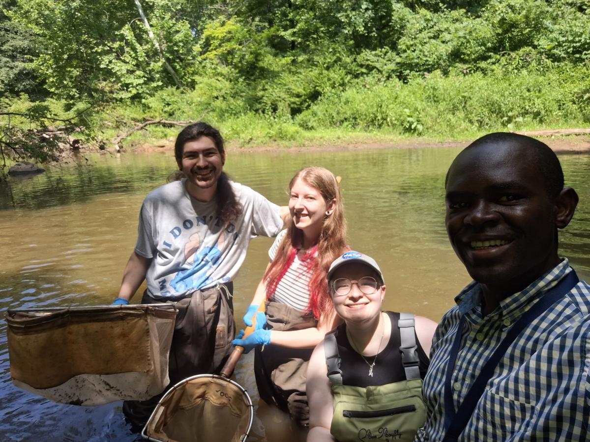 Students wading in stream