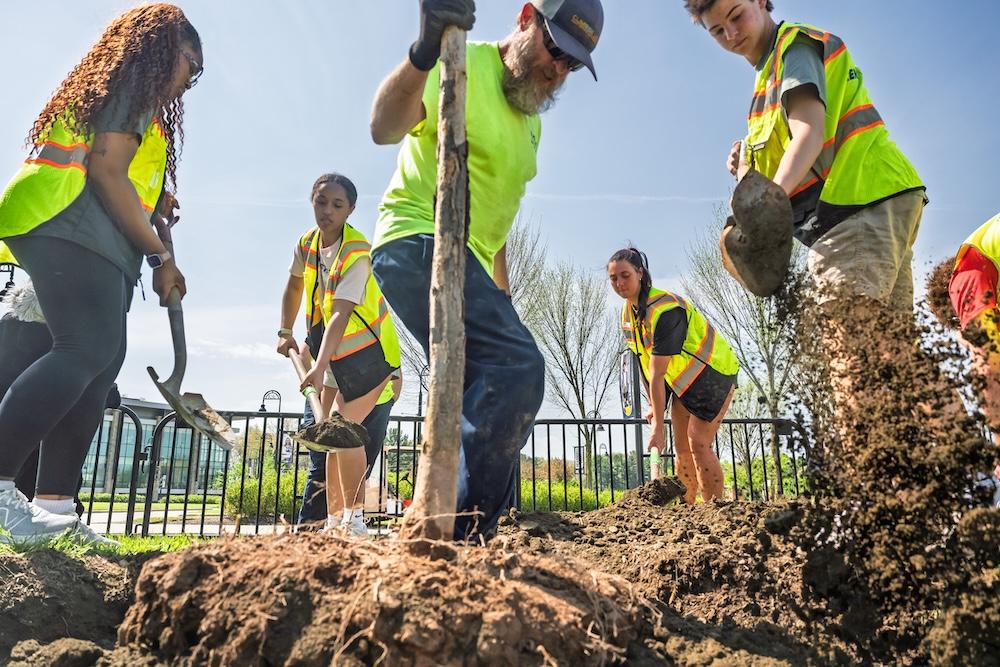 UFM staff and student volunteers set a tree Arbor_Day_Planting_2026