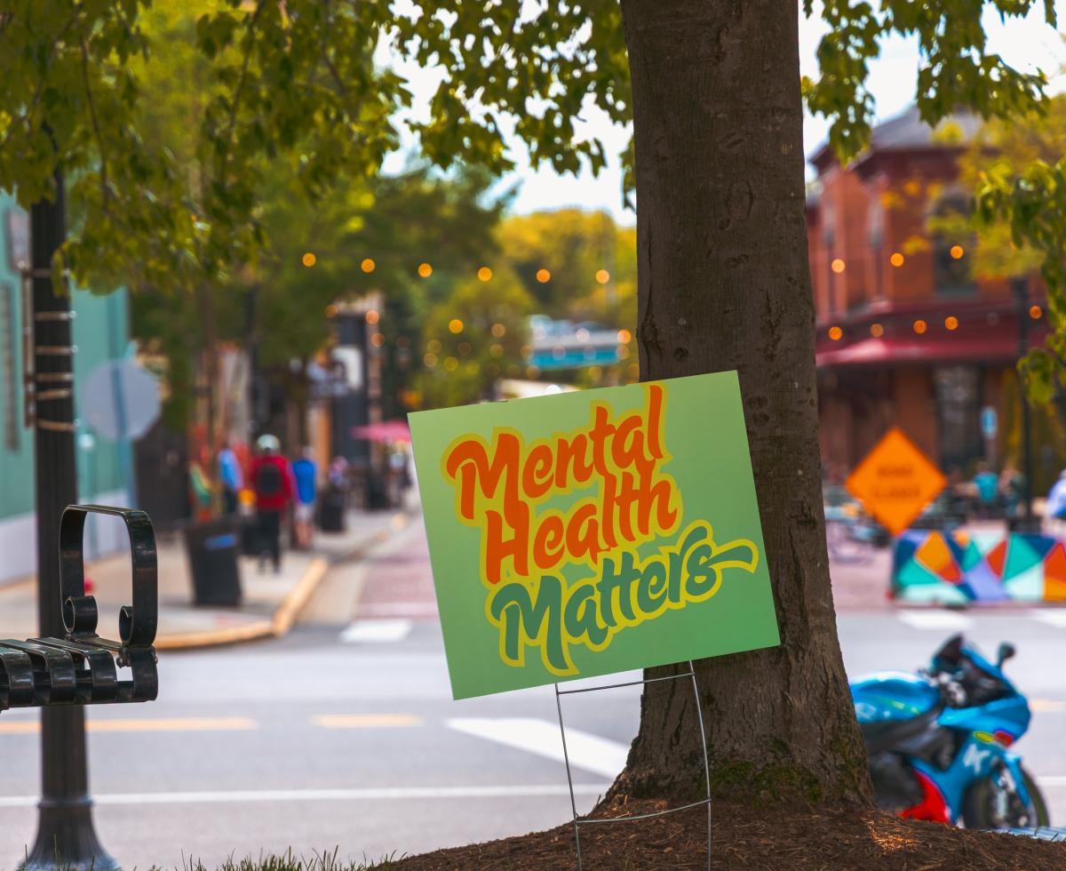 A photo of downtown Kent, Ohio with a sign that reads, "mental health matters"