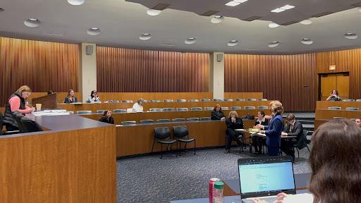 Mock Trial team practices, here, an "attorney" talks to a judge.