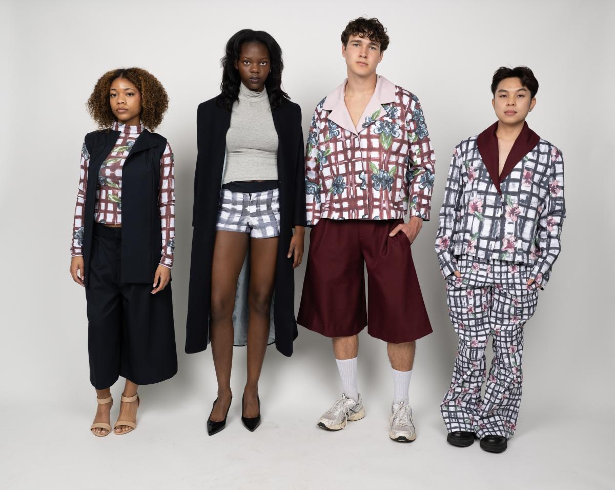 four models wear garment sets with solid anvy blue jacked and pastel blue and red grid patterned tops and bottoms. 