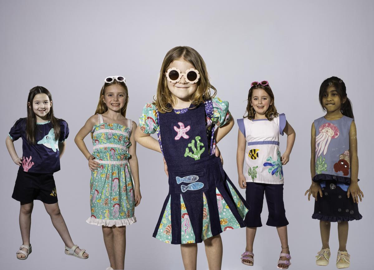 Child models wear Garments with organics shapes and animal appliques 