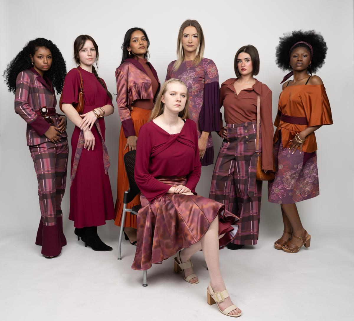 several models pose wearing various plaid garments in shades of magenta and oragne
