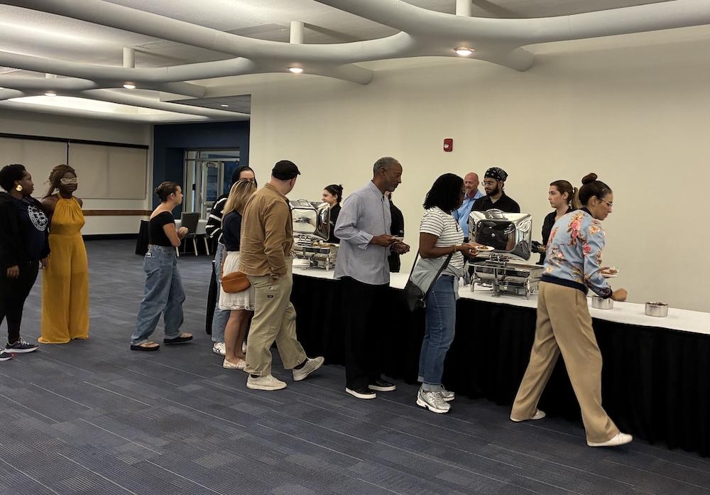 Cultural Cafe attendees in line for traditional Nigerian food