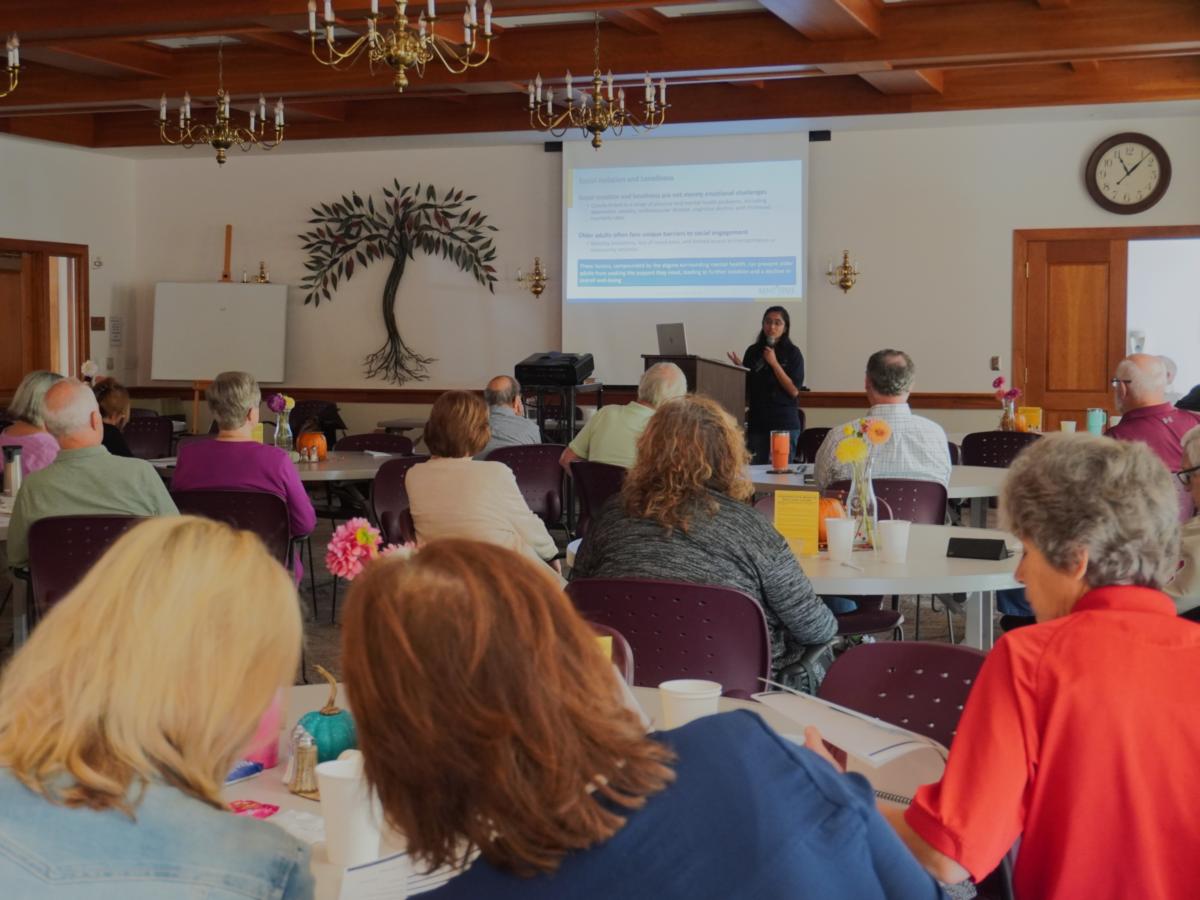 Hilori Tripathi, MPH students, presents the results of the Older Adults Needs Assessment