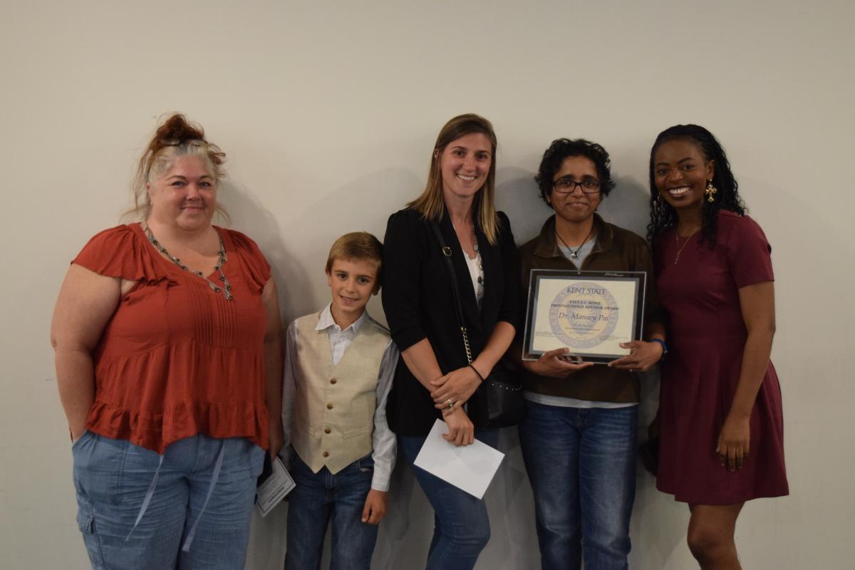 Manacy Pai, Ph.D. (second from right) with Adedayo Adeagbo (right) and Paula Konz's family