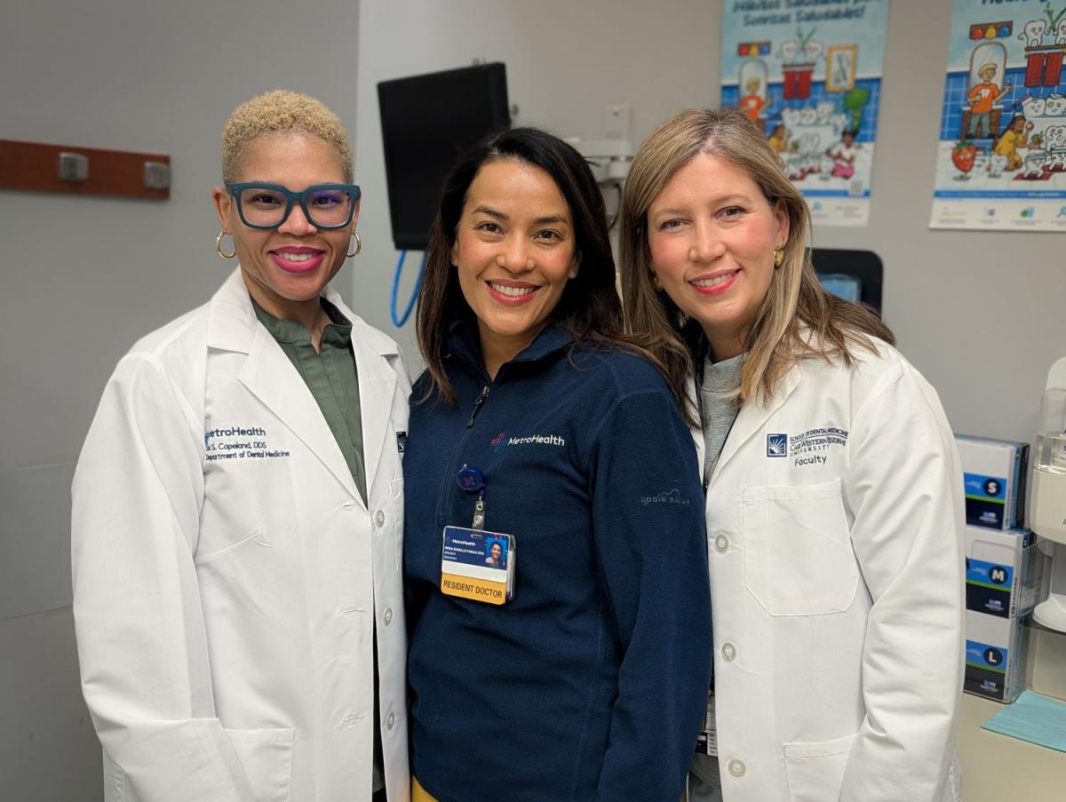 Rosa Bonillo Farias, center, is an internationally trained dentist participating in a partnership between MetroHealth and Kent State that integrates public health education into clinical dental training. Dr. Joi S. Copeland, Department of General Denistry, left, is her mentor and Victoria Barany Nunez, is director of General Denistry at MetroHealth.