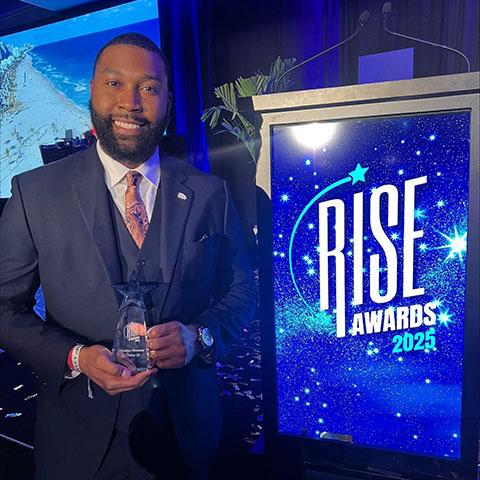 Diauntae Morrow with the RISE “35 Under 35” award.