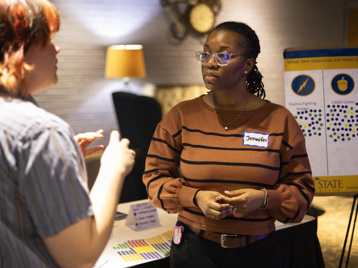 Jennifer King, Ph.D. conducting a survey at the event.