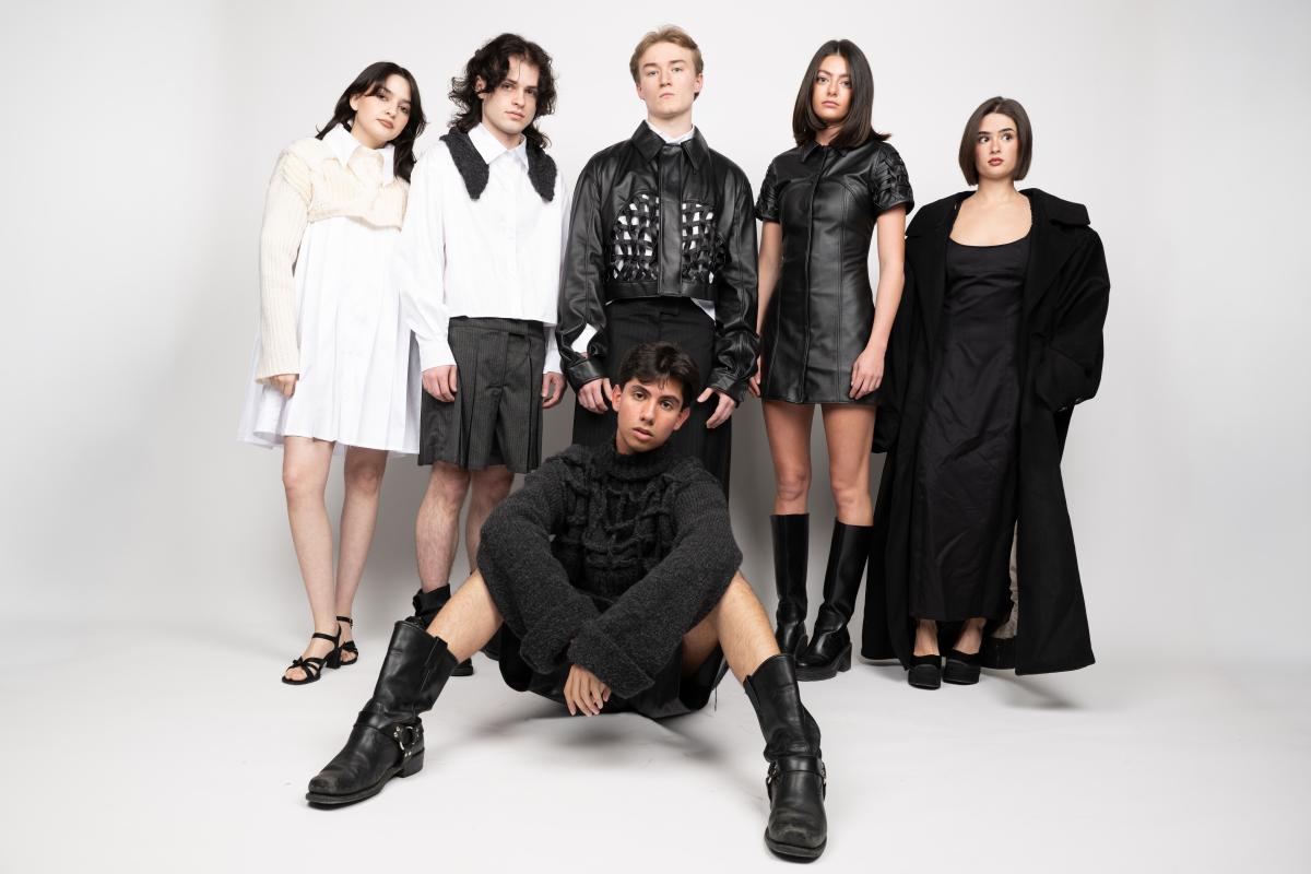 models wearing a collection featuring black and white knitwear mixed with leather and linen fabrics