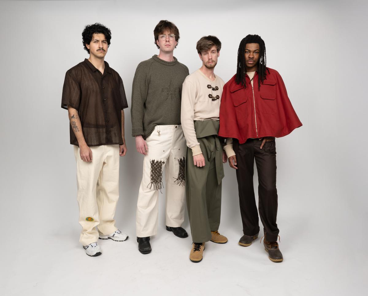 four models wear streetwear including a red poncho and sheer button up top
