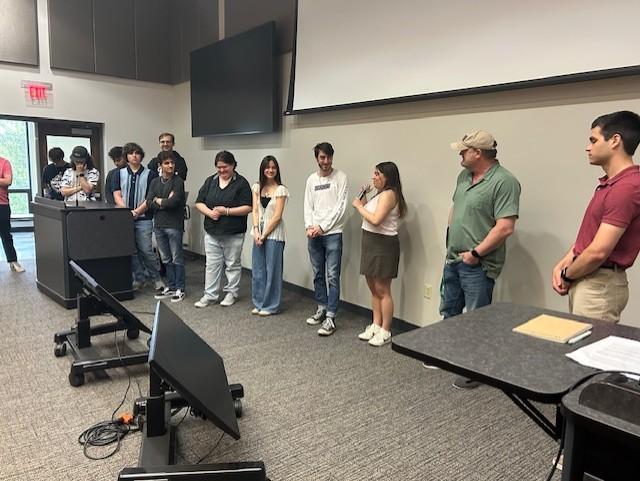 Students present at end of semester screening for films