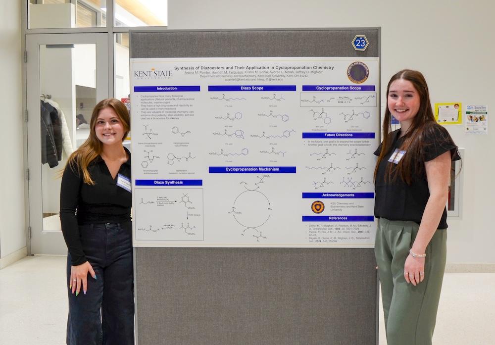 Hannah standing with Chem Board