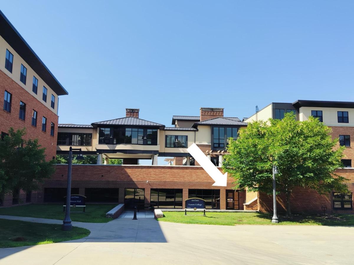 An image of the Honors College with an arrow pointing to the entrance
