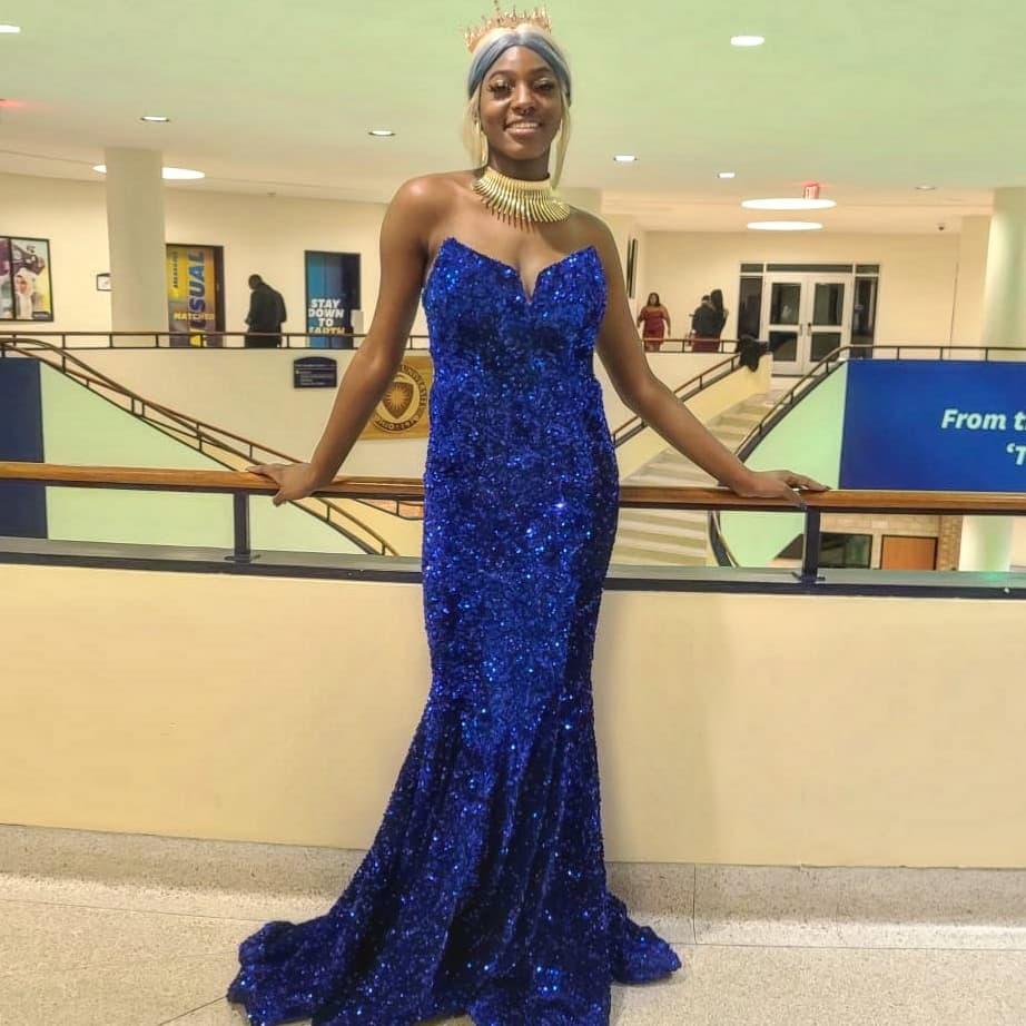 Atira posing in her dress