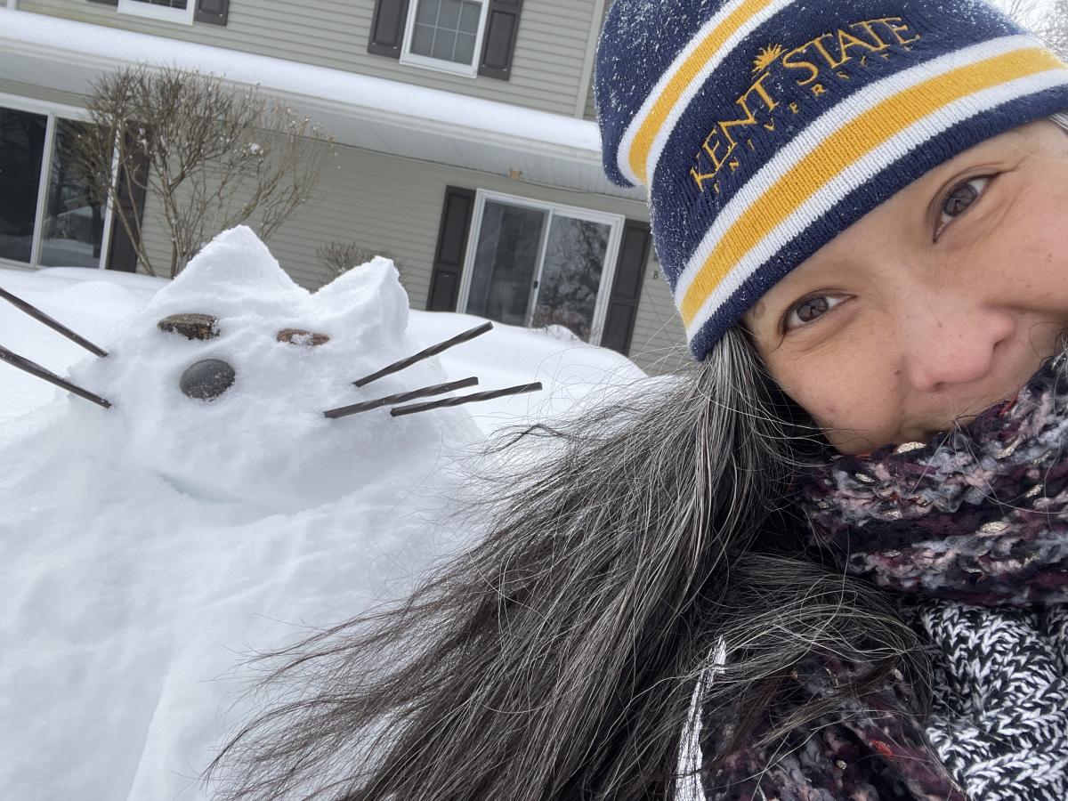 Mahli Mechenbier and the snow version of her cat.