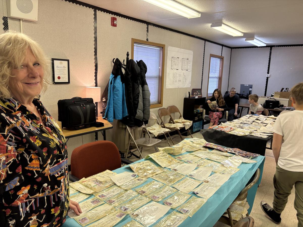 Linda Spurlock next to collected artifacts
