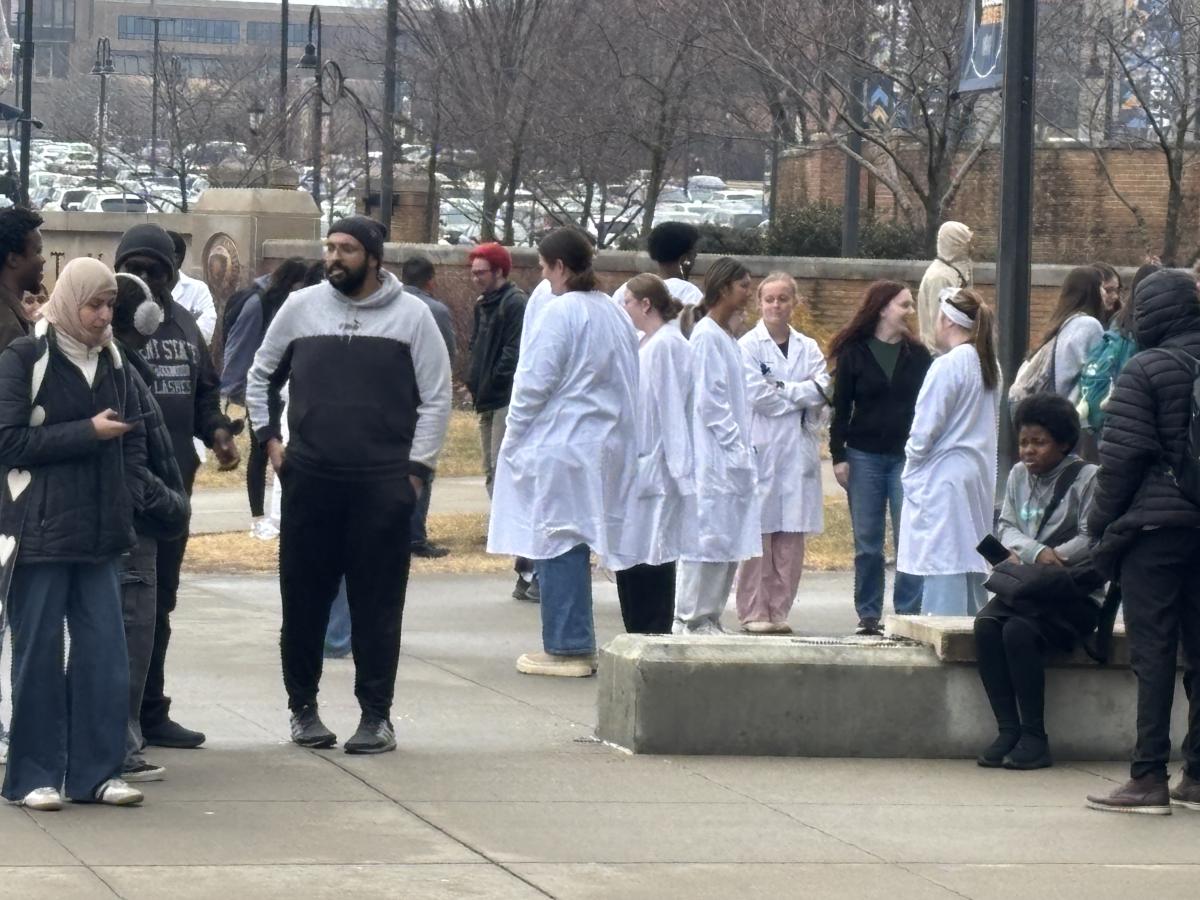 Students stand outside the Integrated Science Building following liquid nitrogen leak