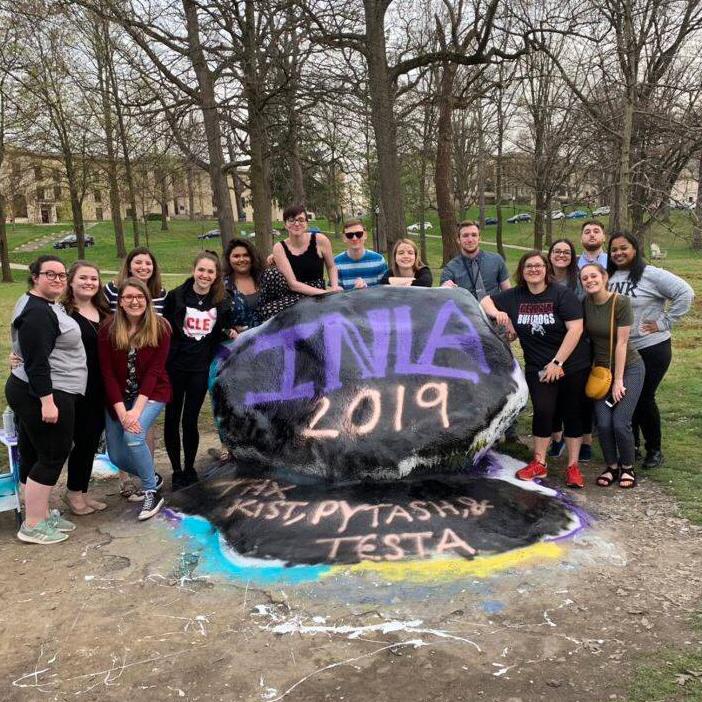 Integrated Language Arts students with painted Kent State rock