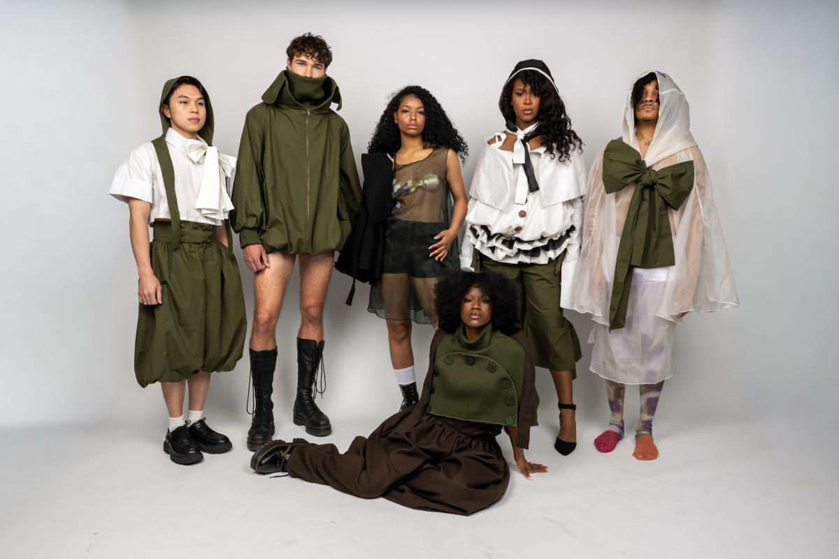 a group of models wearing forest green garments in a variety of styles