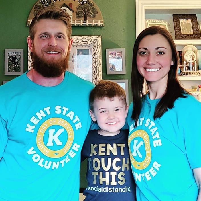 Alumna Jessie, her son, Ross and her husband posed in Alumni Day of service t-shirts