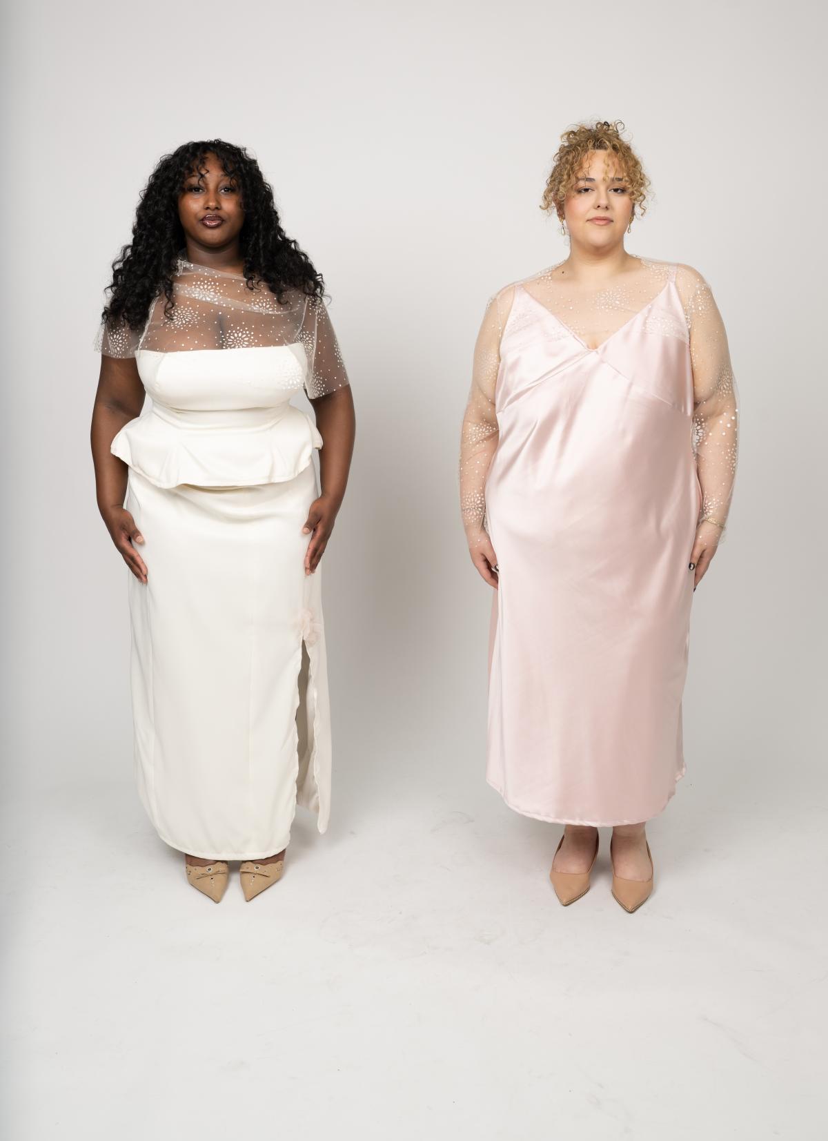 two models wear dresses. one is cream with a peplum top structure and a sheer fabric across the neckline featuring custom beadwork. the other is a light pink slip dress with a sheer fabric across the neckline and down the arms featuring custom beadwork