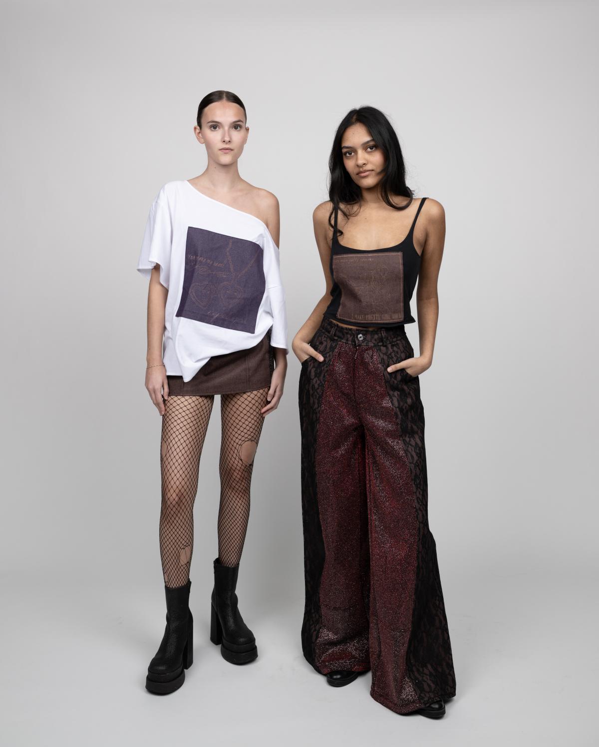 two models pose wearing a custom off the shoulder t-shirt with a brown skirt and fishnet tights and a custom tank top paired with animal print wide-legged pants