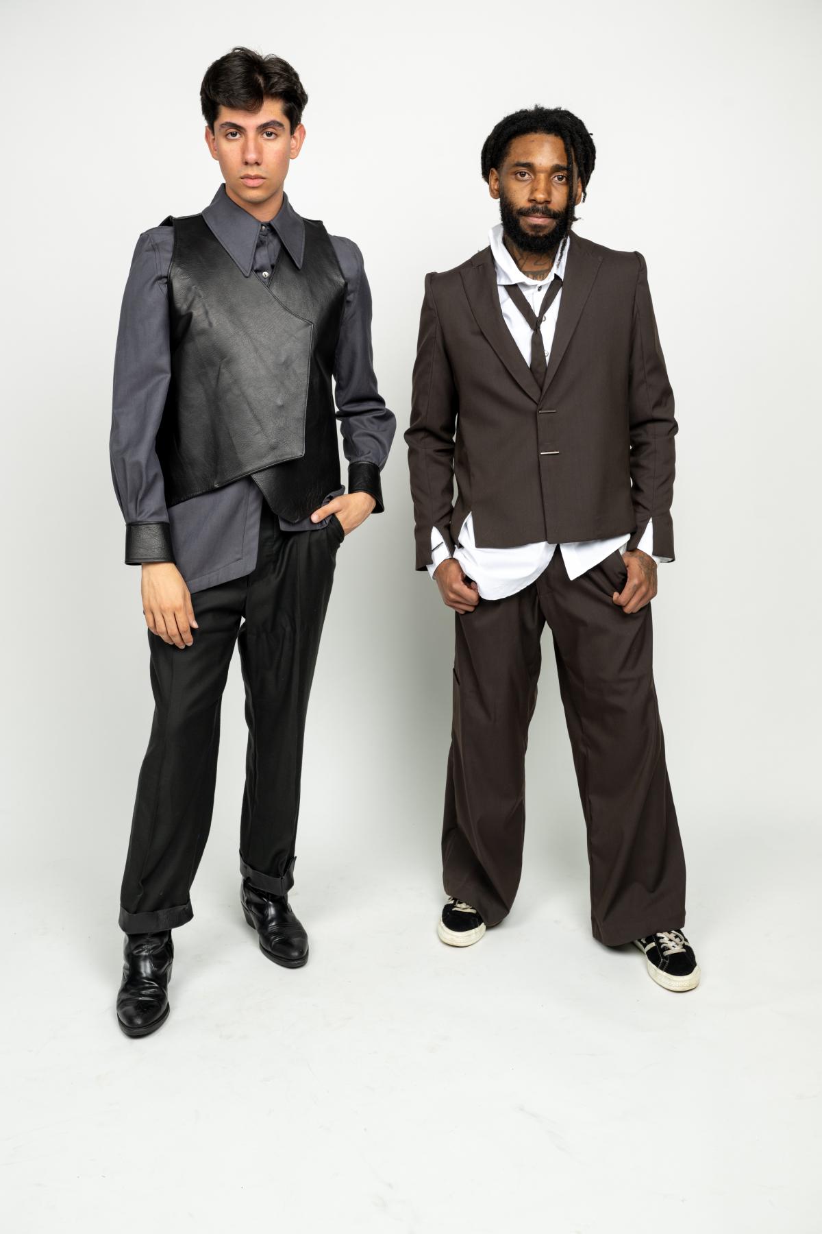 two models wear unique suits and vests 