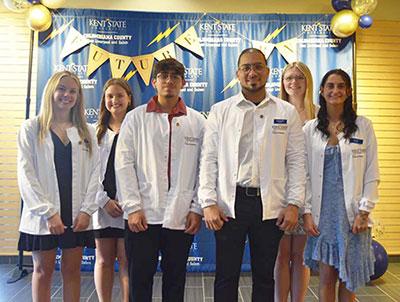 Receiving their white coats were (front, from left) Samantha Gainor, Allie Gries, Christopher Rodriguez, Alexander Flores-Pizarro, Madison Rose and Brylee Melia.
