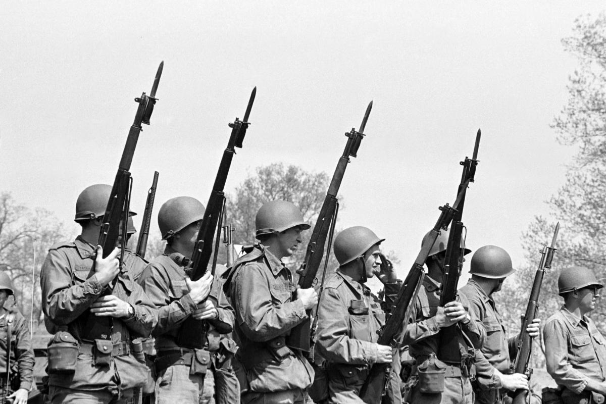 On May 4, 1970, at Kent State University, Ohio National Guardsmen stand with rifles, bayonets fixed. (Photo Credit: News Service May 4 photographs, Kent State University Libraries, Special Collections and Archives)