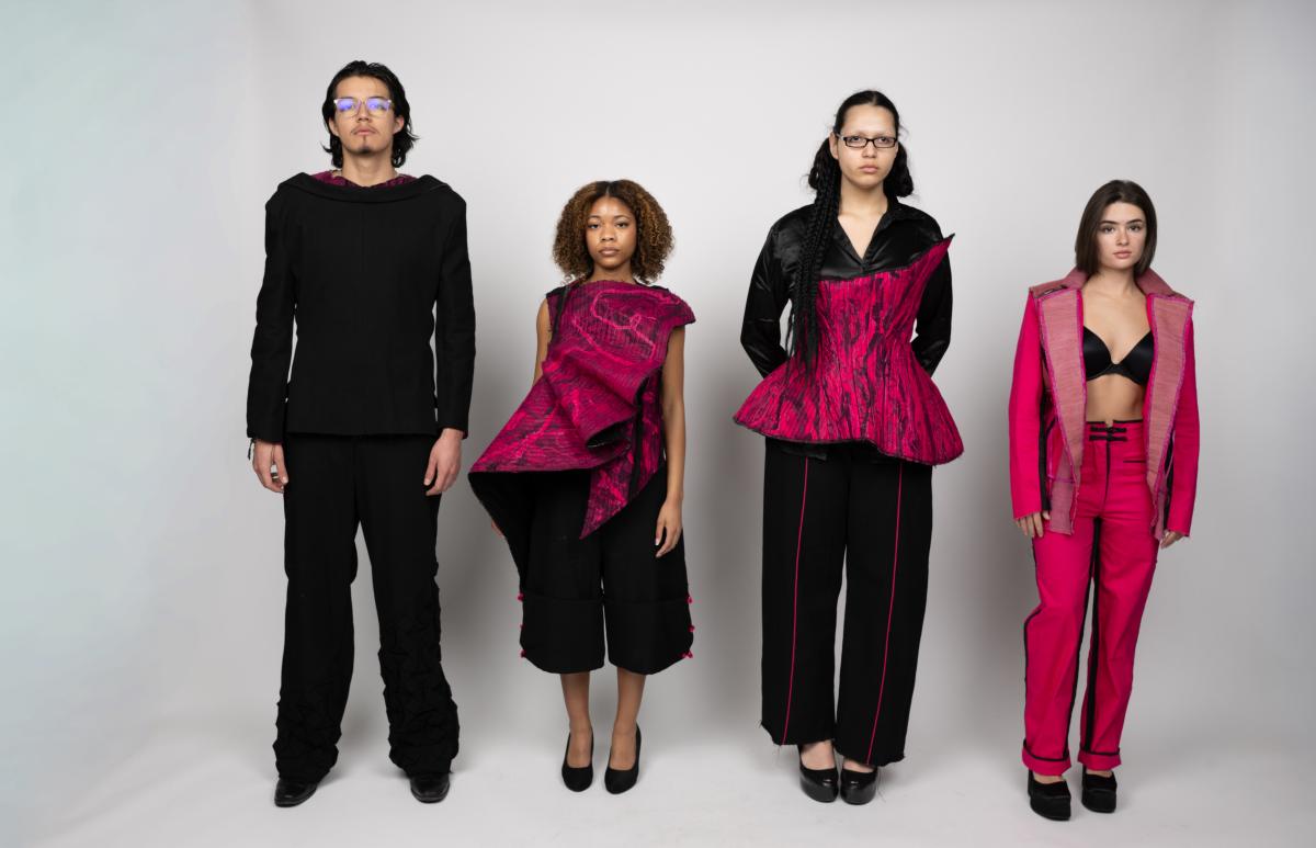 four models wearing tailored suits in red and black with unique shapes