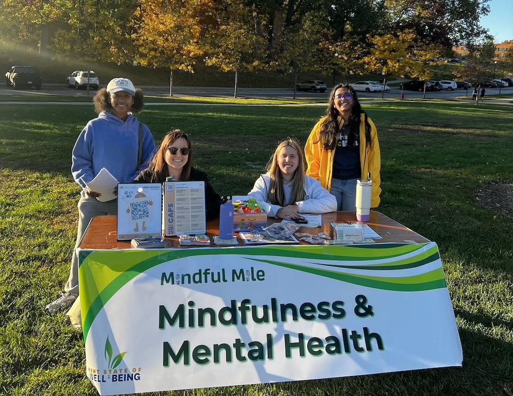Shweta and Volunteers at an activity table for the Mindful Mile event