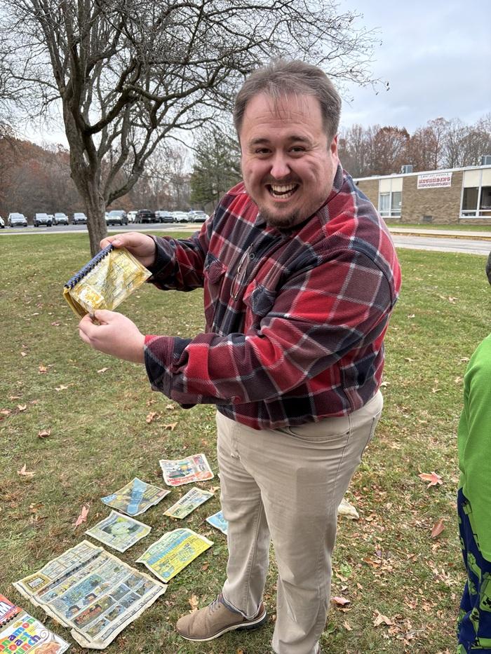 P.J. Herrera finds a booklet that he helped make in 2000