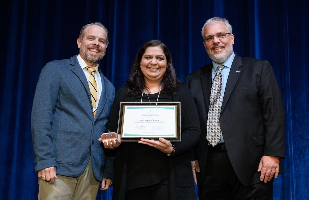 Tina Patel, interior design associate professor, at UTC Conference receiving Glenn Frank Distinguished Teaching Award