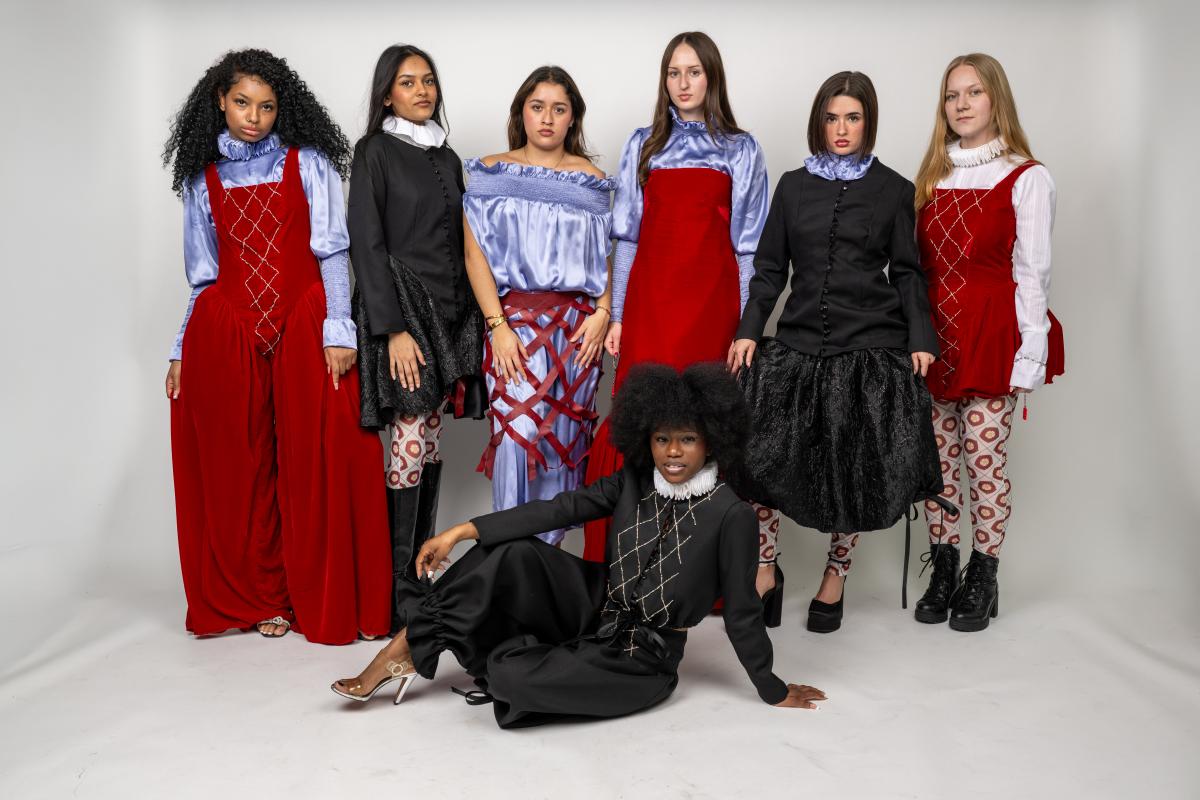 models wear victorian inspires outfits including dresses and suits