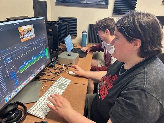 Plested (behind) and Waggle (foreground) working on film