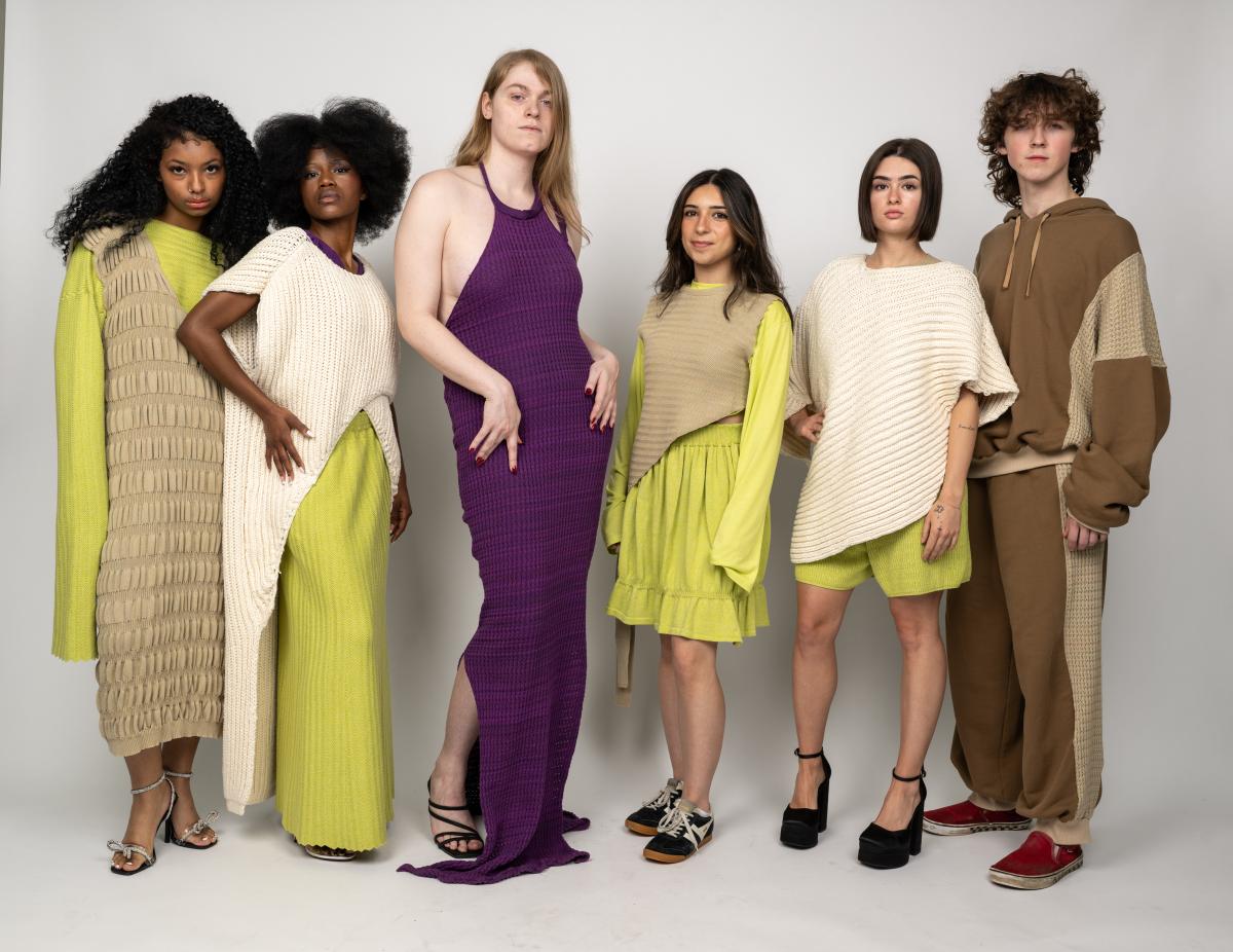 several models wear chartruse dresses with knitwear over top while others wear matching lounge sets and one wears a purple floor-length dress