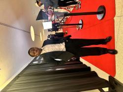 Ridwan Olayiwola dressed in a formal suit at an event
