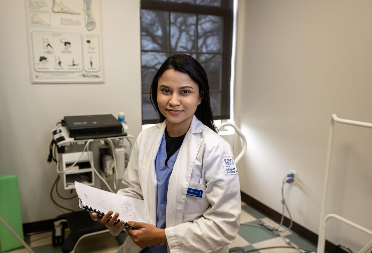 Saloni Christian, a third-year student at Kent State University's College of Podiatric Medicine, sits in a clinical exam room. (Photo credit: Bob Christy)