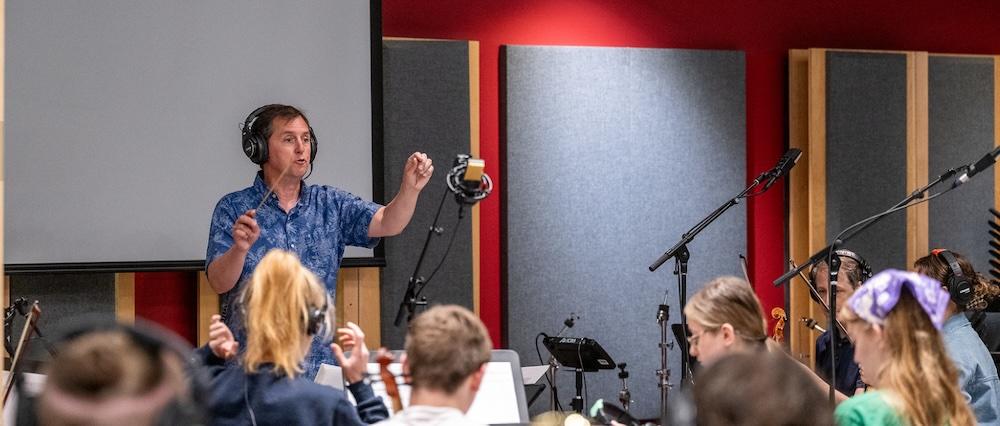 Scott Hallgren conducts during ֱ State collaboration for film score