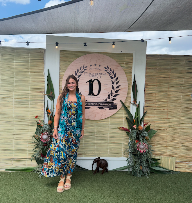 McCullough and an anniversary banner.