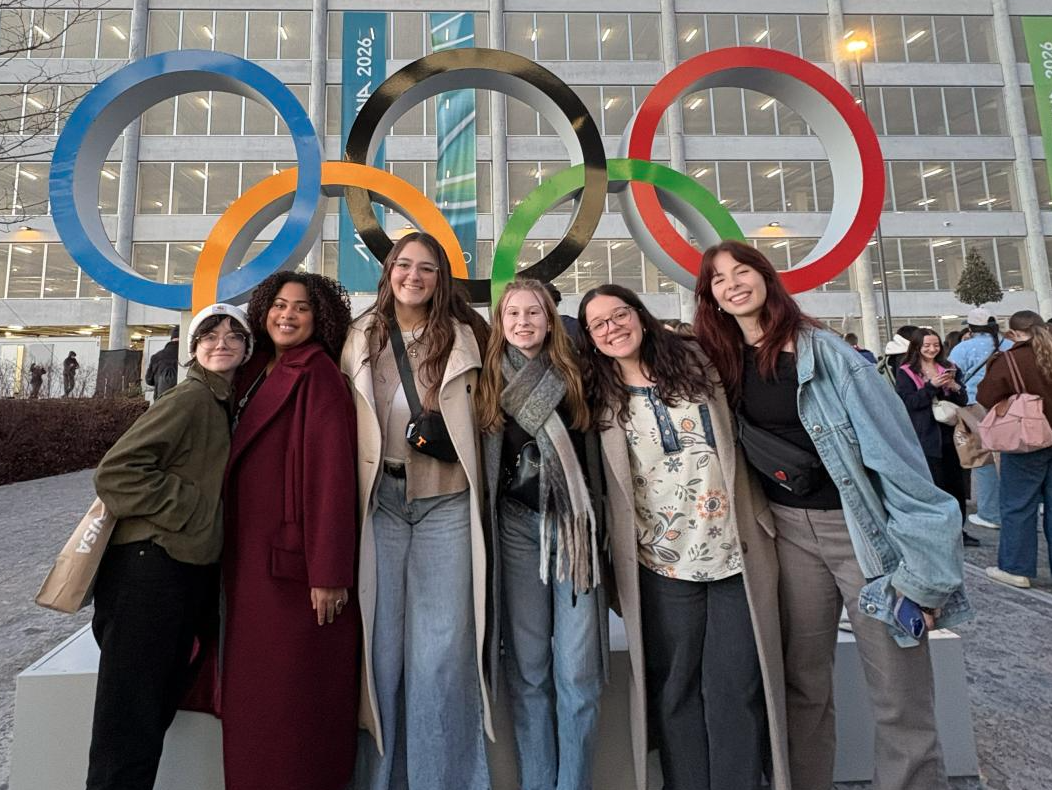 Alex Newnes and friends in front of the Olympic Rings.