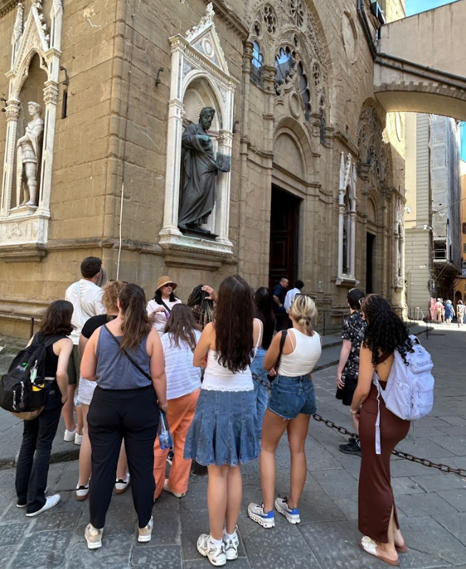 Dr. Chi-hua with her students in front of a historical building in Florence, Italy
