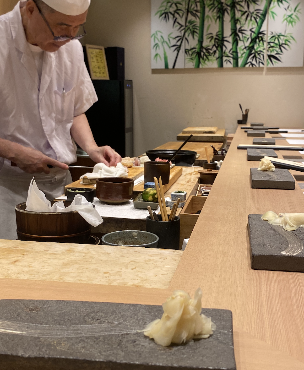 Sushi experience in Japan. The Chef is making the sushi in front of the counter.