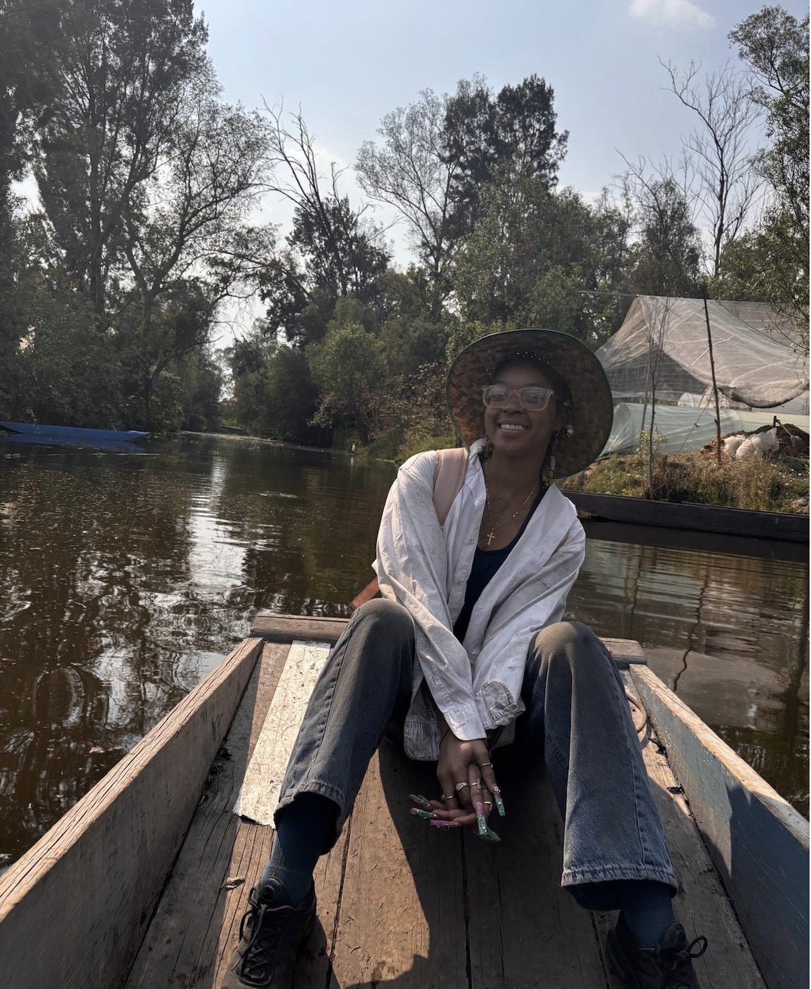 Dae'onii riding on a trajinera boat.