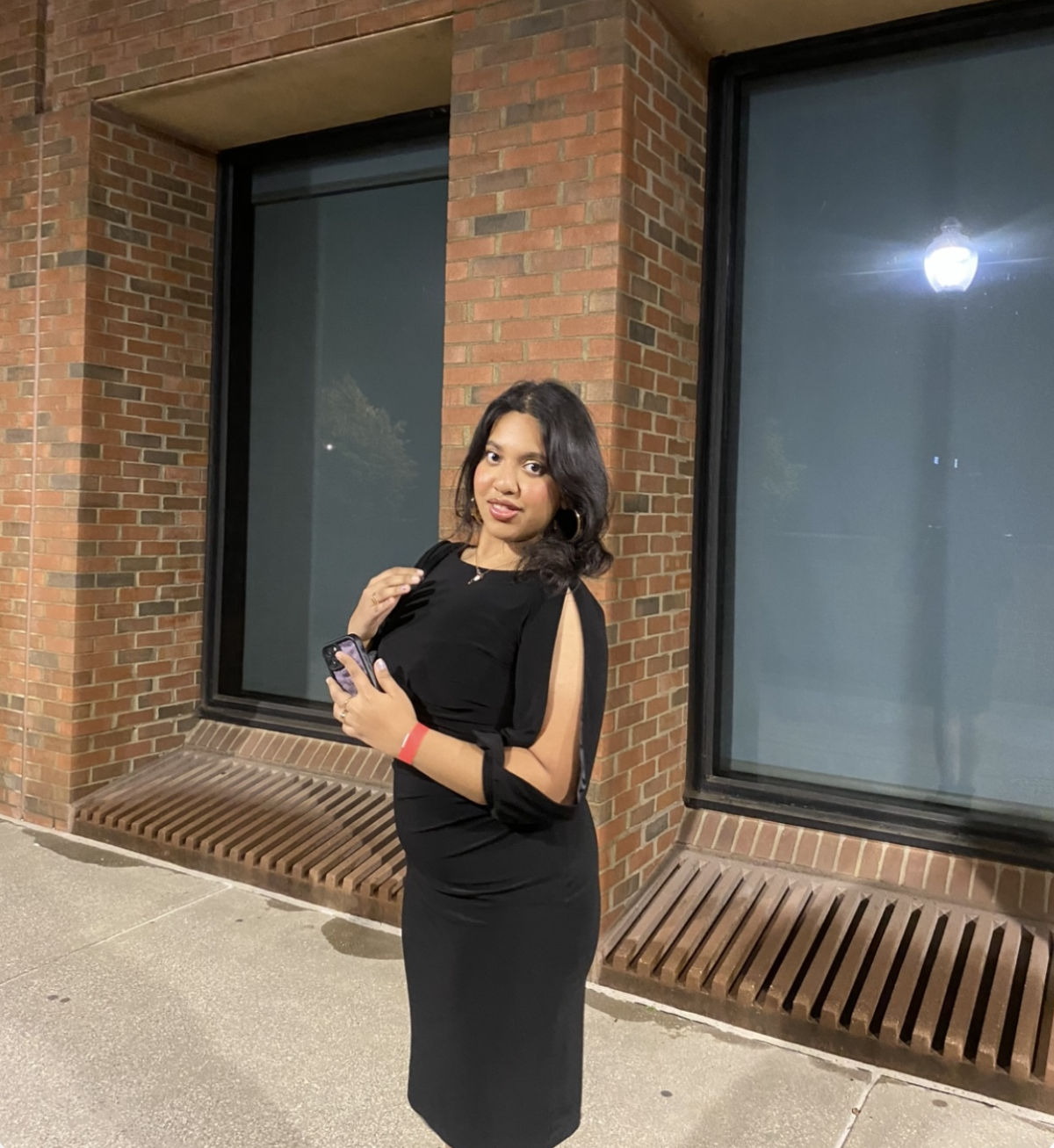 Ittiba in a black dress.